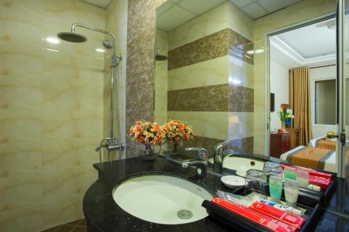 Ett badrum på Vong Xua Boutique Hotel