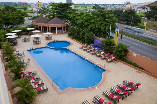 an overhead view of a swimming pool on a hotel at African Regent Hotel in Accra