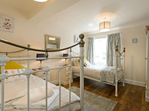 a bedroom with two beds and a window at Church View - Ukc2302 in Wainfleet All Saints