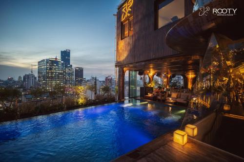 a large swimming pool on the side of a building at The Myst Dong Khoi in Ho Chi Minh City