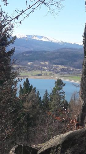 a view of a lake with a snow covered mountain at Apartament Nina in Jelenia Góra