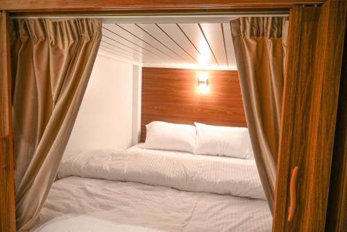 Cama o camas de una habitación en Goodliving vacation homes