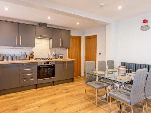 a kitchen and dining room with a table and chairs at The Linden Suite - Uk40475 in Willerby