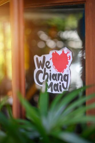 a sign that says we are changing nations at Estia Chiangmai in Chiang Mai