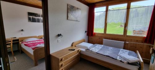 Ein Bett oder Betten in einem Zimmer der Unterkunft Hôtel des Portes du Soleil