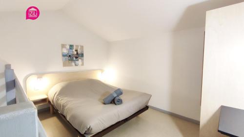 Posteľ alebo postele v izbe v ubytovaní Le Beausoleil par iZiLi - Calme et confort - Futuroscope