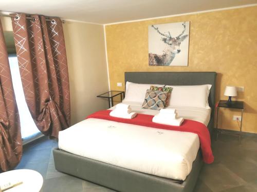 a bedroom with a bed with a red blanket at TORINO VACANCY 4 - Bridge House in Turin