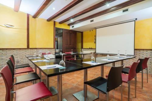 a conference room with a large table and chairs at F&G Logroño in Logroño