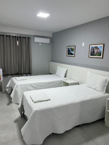 Katil atau katil-katil dalam bilik di Alto da Serra Hotel