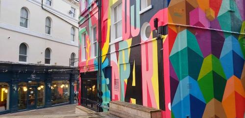 a colorful mural on the side of a building at Beautifully appointed, period seaside apartment in Folkestone