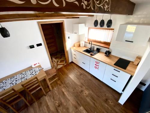 an aerial view of a kitchen in a tiny house at Domek Góralski na Ubocy z jacuzzi in Białka Tatrzanska