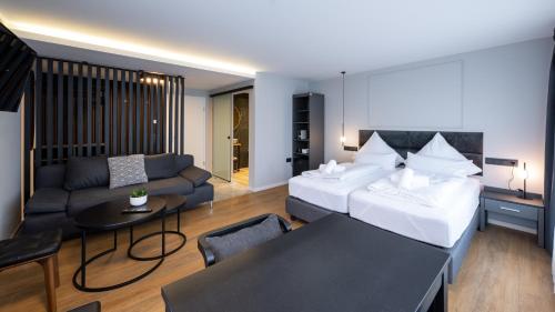Postel nebo postele na pokoji v ubytování Hotel Metropol