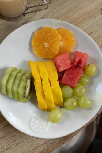 a plate of fruit and vegetables on a table at Sublime Comporta Country Retreat & SPA in Comporta