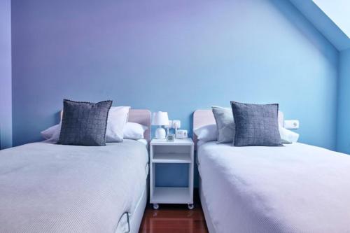 A bed or beds in a room at Apartamento La Calma, plaza de La Inmaculada, en el centro de León