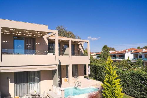 an image of a house with a swimming pool at Cavo Delea Villas & Suites in Possidi