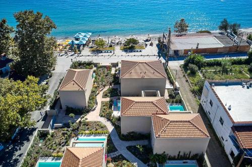 an aerial view of a resort near the ocean at Cavo Delea Villas & Suites in Possidi