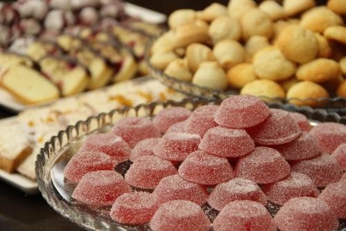 a bunch of different types of pastries on a table at ARDEN PALACE Medical Resort & SPA in Satanov