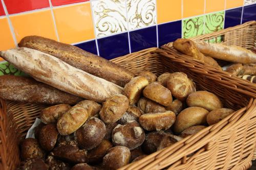 a bunch of baskets filled with different types of bread at ARDEN PALACE Medical Resort & SPA in Satanov