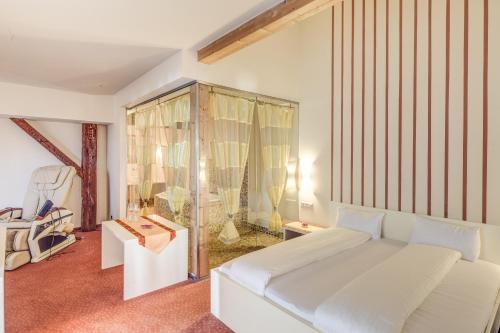 Postel nebo postele na pokoji v ubytování Hotel Kiwano Graz