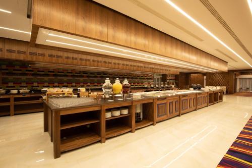 a large kitchen with a counter with some drinks on it at ARDEN PALACE Medical Resort & SPA in Satanov