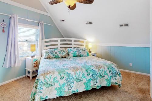 a bedroom with a large bed with blue walls at Knot a Care in Buxton
