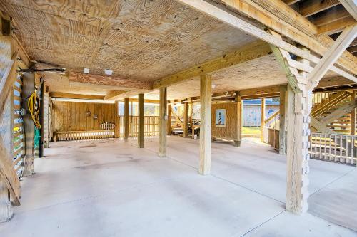 an empty room with wooden walls and ceilings at Knot a Care in Buxton