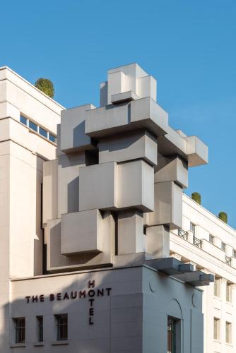 a building with a sculpture on top of it at The Beaumont Mayfair in London