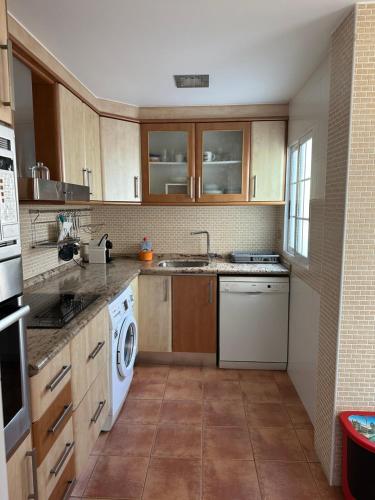 Η κουζίνα ή μικρή κουζίνα στο Cristina Apartamento Center