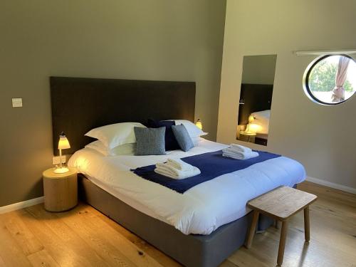 a bedroom with a large bed with a blue blanket at Yorkshire Dales Lodge 2 by Together Travel - 3-Bed Family Retreat in Richmond