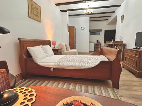 a bedroom with a bed and a living room at CASA 9 in Ferihaza