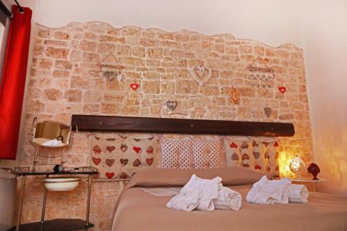 Ένα ή περισσότερα κρεβάτια σε δωμάτιο στο Agriturismo Masseria Alberotanza