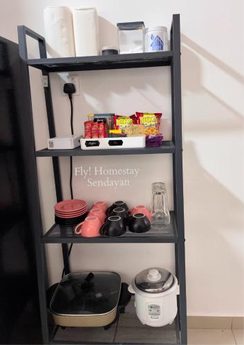 a shelf in a kitchen with food items on it at Fly! Homestay @ Sendayan in Labu