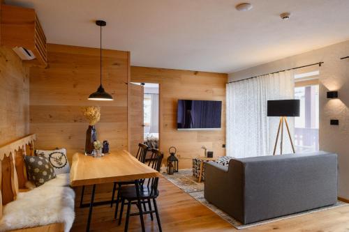 a living room with a couch and a table at Vila Pavlina in Kranjska Gora