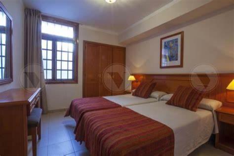 Ένα ή περισσότερα κρεβάτια σε δωμάτιο στο Hotel Malibu Park