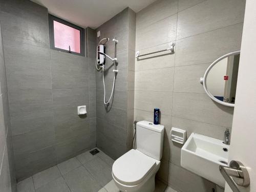 a bathroom with a shower and a toilet and a sink at Wallaway2stay Gravit8 Klang 2 Plus 1Room in Klang