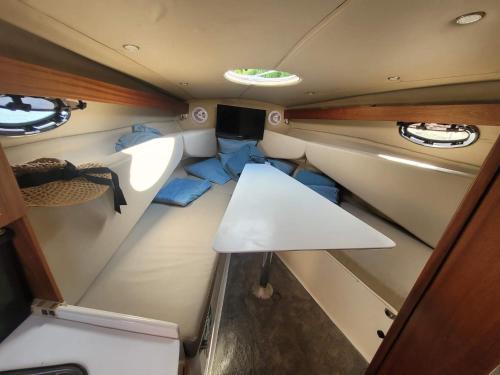 a small room with a table in the back of a boat at River San yacht in Rajskie