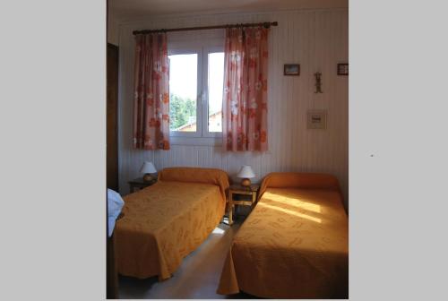 Postel nebo postele na pokoji v ubytování Chalet les lupins-T3