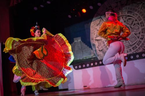 a couple of people dancing on a stage at BlueBay Grand Esmeralda-All Inclusive in Playa del Carmen