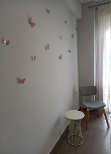 a room with two chairs and a table and a window at MODERN SWEET HOME WITH AMAZING VIEW!! in Serres