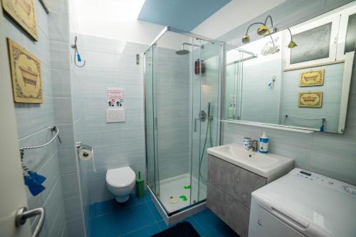 a bathroom with a shower and a toilet and a sink at Oasi della pace in Bisceglie