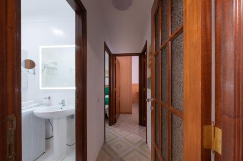 a bathroom with a sink and a toilet at Piso Mirta Santa Cruz Tenerife in Santa Cruz de Tenerife