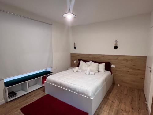เตียงในห้องที่ Grand Park & Bllok Area Rooms