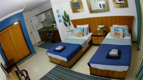Postel nebo postele na pokoji v ubytování Deluxe Apartment Delta Sharm