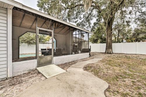 a house with a glass door and a patio at Mt Dora Couples Retreat with Shared Pool! in Dublin