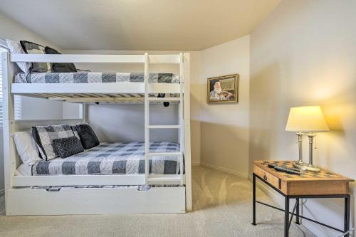 a bedroom with two bunk beds and a desk at Beautiful St George Condo about 5 Mi to Downtown! in St. George