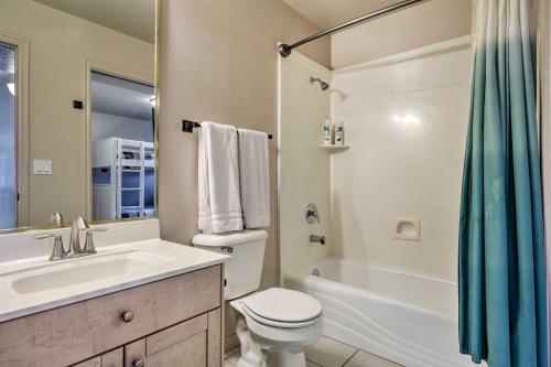 a bathroom with a toilet and a sink and a tub at Beautiful St George Condo about 5 Mi to Downtown! in St. George