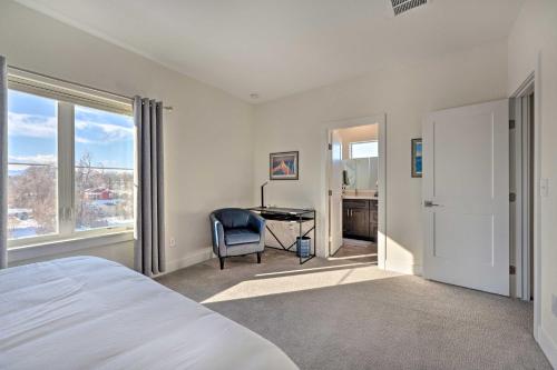 a bedroom with a bed and a desk and a window at Modern Townhome, Day Trip to Colorado Ski Resorts! in Louisville