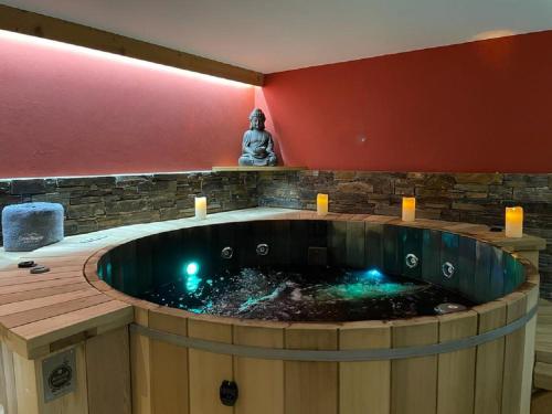 a large hot tub in the middle of a room at MORZINE GUEST CHALET HYPERCENTER Jacuzzi et Sauna in Morzine