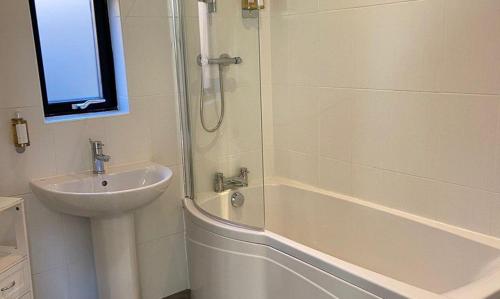 a bathroom with a sink and a shower at Yorkshire Dales Lodge 3 Family 3 Bed in Richmond