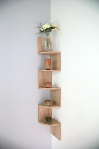 a wooden shelf on a wall with a vase on it at Luxury Loft Lourdes in Lourdes